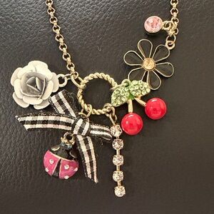 Charming Gold tone Multiple Pendant Necklace